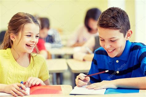 Group Of School Kids Writing Test In Classroom — Stock Photo © Syda