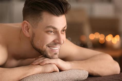 Young Man Relaxing On Massage Table In Spa Salon Stock Image Image Of Health Aromatherapy