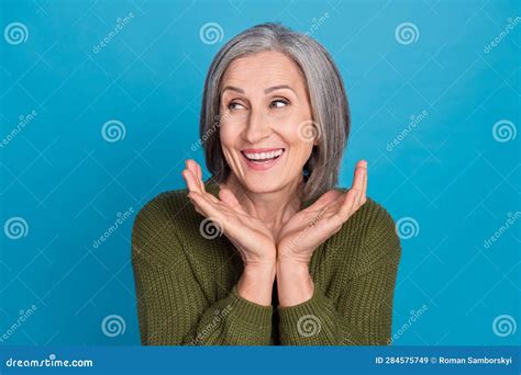 Photo Of Positive Cheerful Woman Hold Palms Under Face Demonstrate