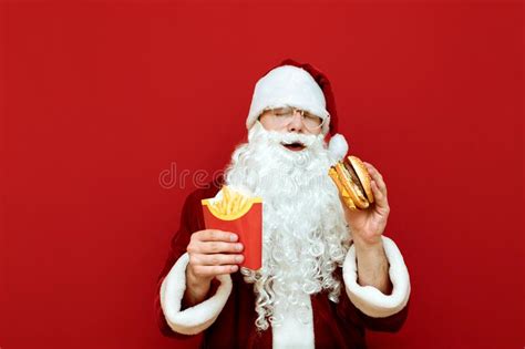 Satisfied Santa Claus Stands With Her Eyes Closed And Fast Food In Her