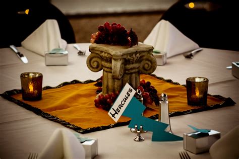 For the table, ancient greek decorations with ancient greece theme, use golden colored plastic dinner plates, and napkins, glass, spoons to match. Ultimate Disney Weddings Centerpieces - Part Two - This ...