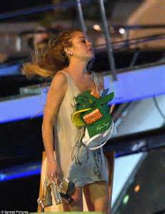 Lindsay Lohan Stumbles Up To Her Boat Barefoot After Late Night In St