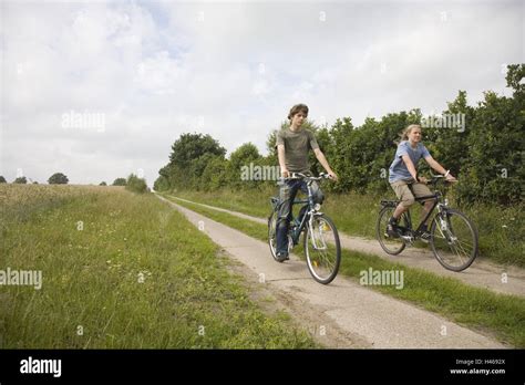 Boys Teenagers Two Bicycle Driving Way Stock Photo Alamy