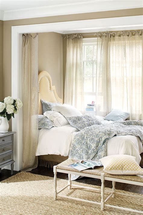 This sections off your bed without sacrificing space. How to Hang Drapes - How To Decorate