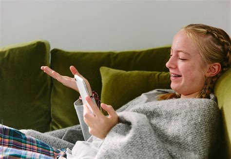 Pre Teen Girl Enjoying A Video Call With A Friend Del Colaborador De