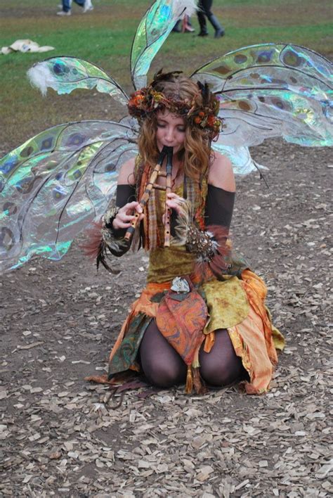 Renaissance Pixie Loving The Cellophane Wings And Feather Wristlets