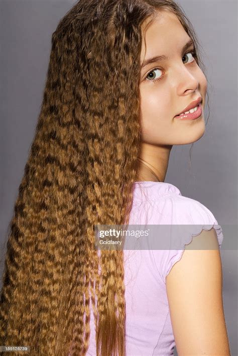 Beautiful Girl With Very Long Golden Curly Hair High Res