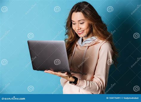 Portrait Of A Smiling Young Girl Using Laptop Computer Stock Image