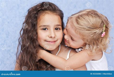 Two Cute Little Sisters Hugging Stock Photo Image Of Dressing