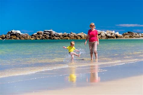 Grandmother With Grandson On The Beach Stock Image Image Of Active