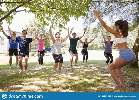 female instructor leading outdoor yoga class stock image image of female class 134202501