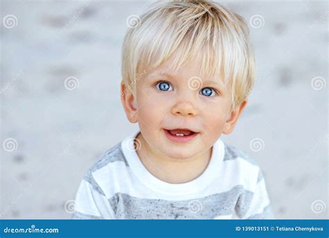 Cute Boy With Blond Hair And Blue Eyes Stock Image Image Of Outdoors
