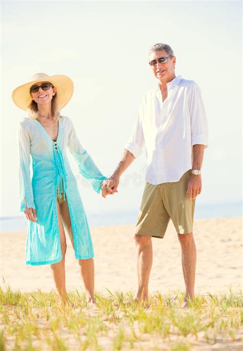 Romantic Couple Walking On The Beach Stock Image Image Of Retirement