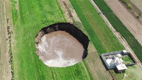 Mexico Massive Sinkhole Threatens To Swallow Nearby House World News