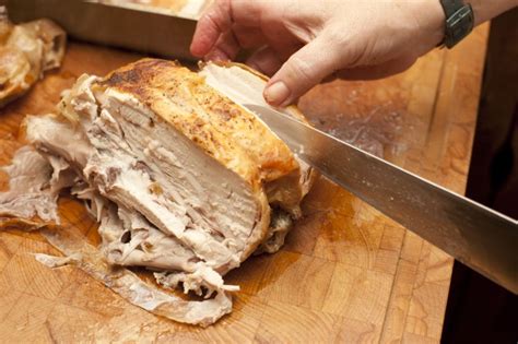 Maybe you would like to learn more about one of these? Man carving a half roast chicken - Free Stock Image