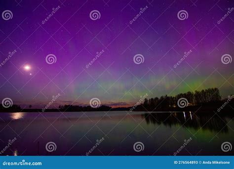 Northern Lights And Its Reflection The Lake Northern Lights Shimmer