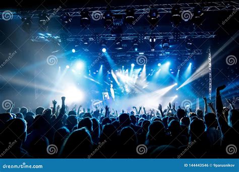 A Lot Of Hands Crowd On Concert Blue Light Stock Photo Image Of
