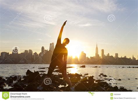 Practice yoga online, day or night, from any city in the world. Woman Yoga Manhattan Skyline Sunrise New York Stock Photo ...