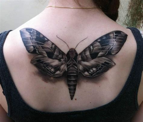 Grey Ink Moth Tattoo On Girl Upperback Moth Tattoo Circle Tattoos
