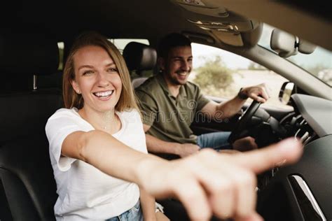 Beautiful Young Couple Sitting On Front Passenger Seats And Driving A Car Stock Image Image Of