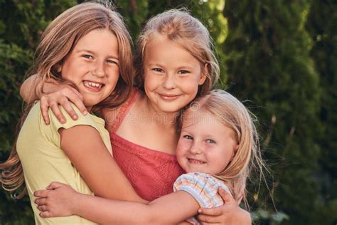 close up portrait of three happy girlfriends cuddling at the park stock image image of