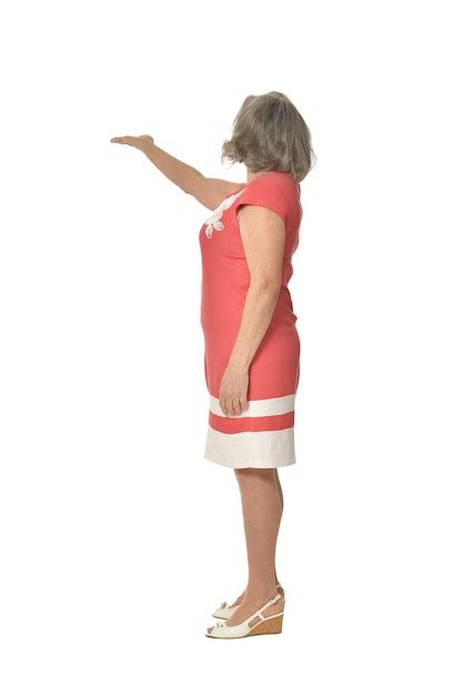 Premium Photo Portrait Of Senior Woman In Red Dress On White Background