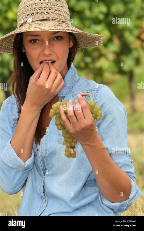 Woman Eating Grapes Stock Photo Alamy