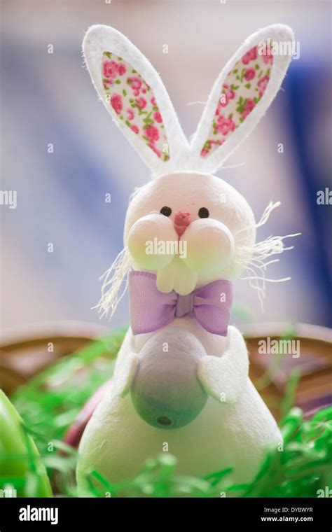 Easter Bunny Holding An Easter Egg Stock Photo Alamy