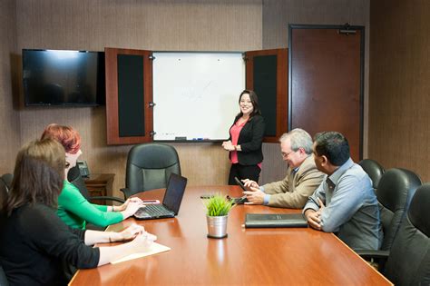 A room in a building, such as an office building, set aside for the use of people to hold meetings. Meeting Rooms