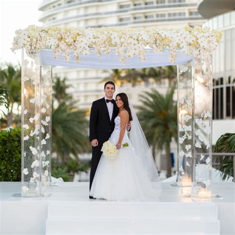 Stunning Acrylic Chuppah With All White Floral Hedges Of Cascading