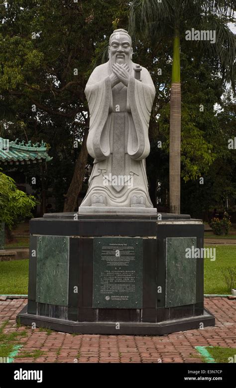 A Stone Statue Of Confucius In The Chinese Garden Near Intramuros