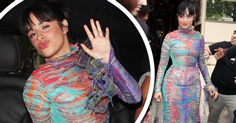 camila cabello showcases her sensational physique in a figure hugging multicoloured gown during