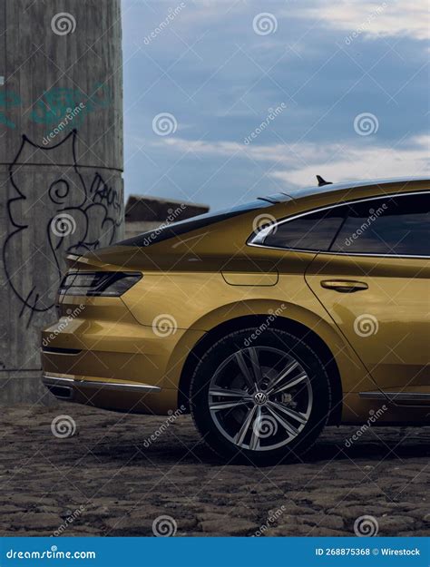 Vertical Shot Of A Volkswagen Arteon Gold Color Editorial Stock Photo