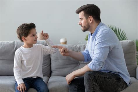 Angry Strict Father Shouting Screaming At Little Son At Home Stock