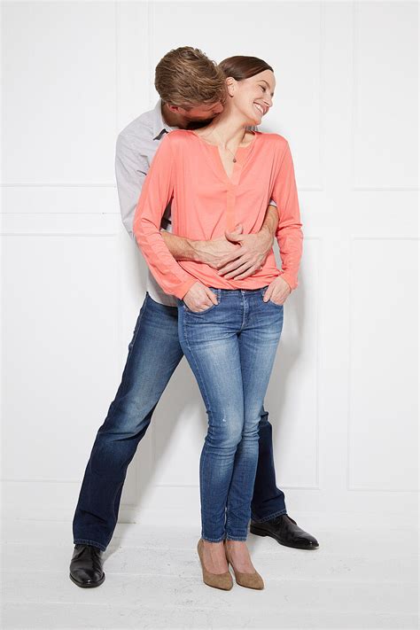 A Man Hugging A Woman From Behind And License Image 12608186