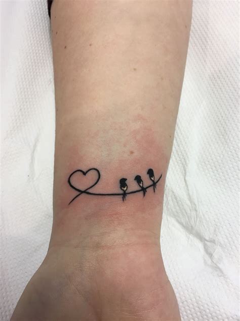 Ike 09 has uploaded 53 photos to flickr. Small heart and birds family wrist tattoo by Travis Allen ...