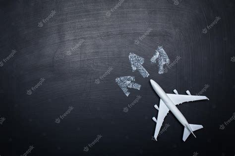Free Photo Toy Airplane Over Chalkboard Background And Arrows Drawings
