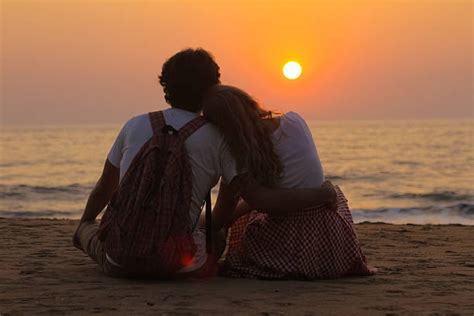Couple Watching Sunset Stock Photos Pictures And Royalty Free Images