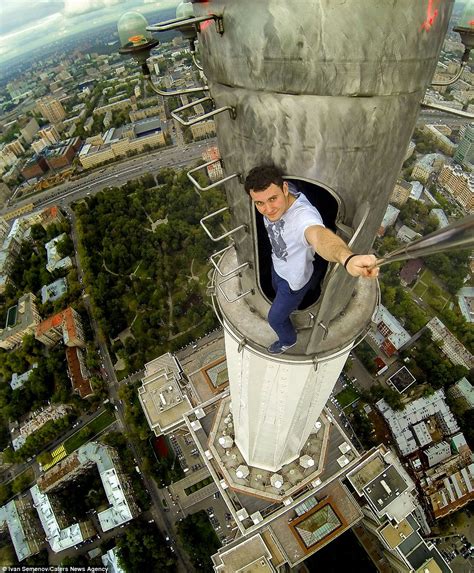 Pictures Show Russian Daredevils Dangling Off The Citys Tallest