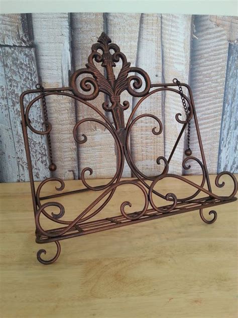 Attractive metal cookbook stand in antique rust finish, with scroll designs and cutouts, keeps your cookbooks clean at the perfect angle for easy viewing. Vintage Cookbook Stand, Metal Book Holder, 1970s Kitchen ...