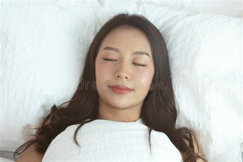 Asian Women Sleeping And Sweet Dream On White Bed In Bedroom Stock