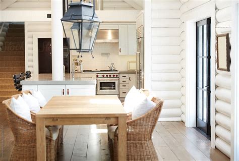 Dining Room And Kitchen In Modern Design Log Cabin Home By Stocksy Contributor Trinette Reed