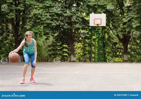 Young Girl Dribbling A Basketball Stock Image Image Of Playground