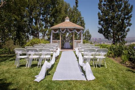 Secure A Wedding Aisle Runner On The Grass For An Outdoor