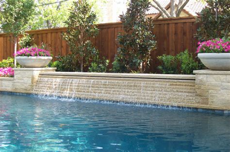 See how a big heap of assorted rocks and pebbles is transformed into a shallow pond, incorporating larger boulders, plants and a bamboo fountain. Water Features - Traditional - Pool - Dallas - by Pool Environments, Inc.