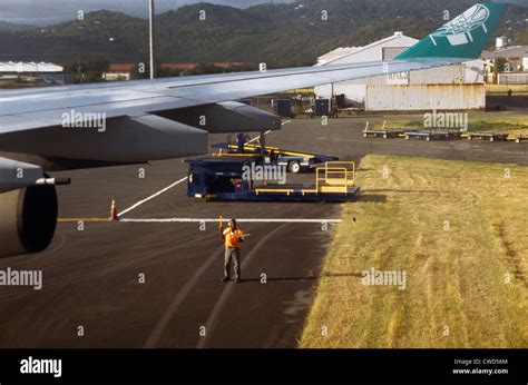 St Lucia Hewanorra International Airport Ground Crew Directing Plane