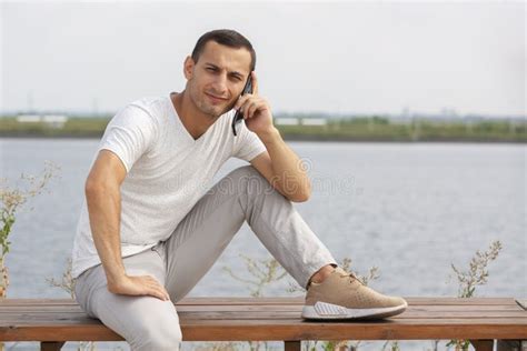 Handsome Young Man Sitting Bench Smiling Candid Stock Photos Free