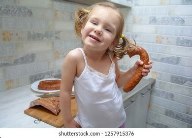 Funny Hungry Baby Girl Eats Smoked Stock Photo 1254946279 Shutterstock