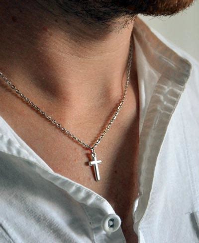 If you're feeling particularly flashy, add a diamond or gemstone for a refined touch or a splash of color. A Man's Guide To Wearing Necklaces - RING OF GOD