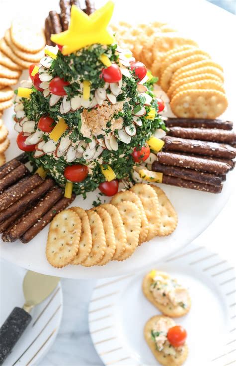 Add parmesan cheese and 1/2 of the cheddar or mozzarella cheese and beat to combine. A Festive Christmas Tree Cheese Ball Appetizer Recipe